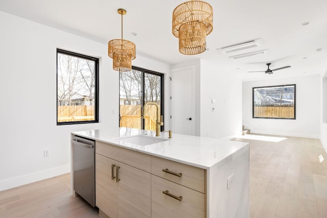 802 Philco Dr Unit 2, Austin, TX 78745 - kitchen with a sink, stainless steel dishwasher, a chandelier, modern cabinets, and light wood finished floors