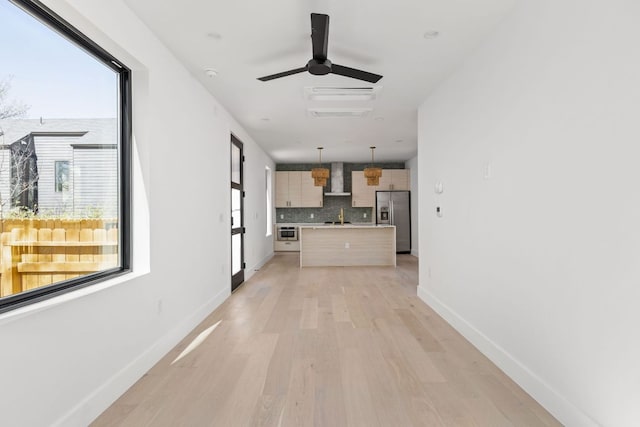 802 Philco Dr Unit 2, Austin, TX 78745 - hall featuring light wood-type flooring, a sink, and baseboards