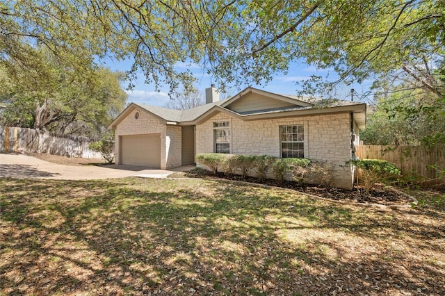 5709 Hudson Bend Rd, Austin, TX 78734 - ranch-style house with a chimney, driveway, an attached garage, and stone siding