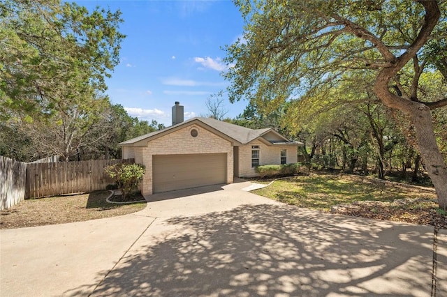 5709 Hudson Bend Rd, Austin, TX 78734 - ranch-style house with driveway, a chimney, a garage, and stone siding