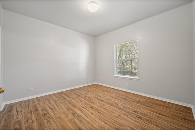 5709 Hudson Bend Rd, Austin, TX 78734 - unfurnished room featuring wood finished floors and baseboards
