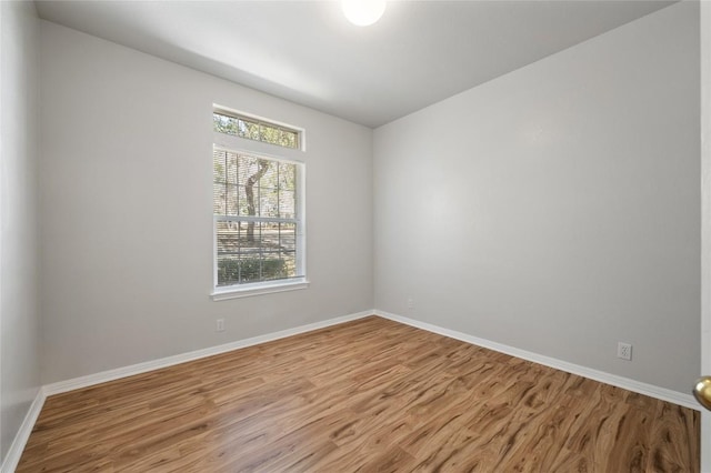5709 Hudson Bend Rd, Austin, TX 78734 - spare room featuring wood finished floors and baseboards