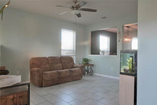1400 Bess Cv, Leander, TX 78641 - living area with baseboards, ceiling fan, and light tile patterned flooring