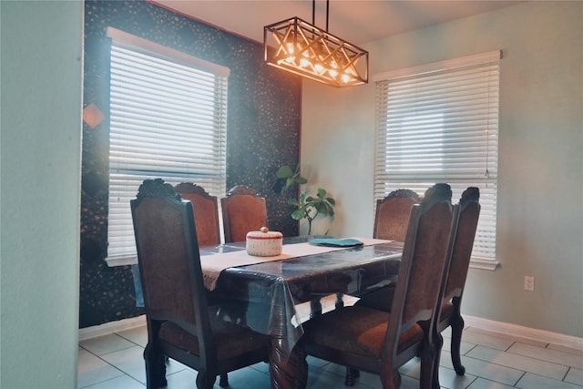 1400 Bess Cv, Leander, TX 78641 - tiled dining room featuring baseboards, wallpapered walls, and a chandelier
