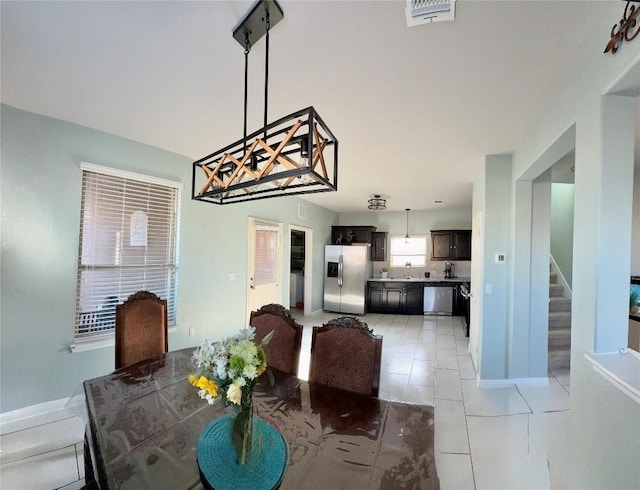 1400 Bess Cv, Leander, TX 78641 - dining room featuring stairway and light tile patterned floors