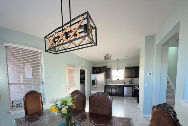 1400 Bess Cv, Leander, TX 78641 - dining space with light tile patterned floors and stairway