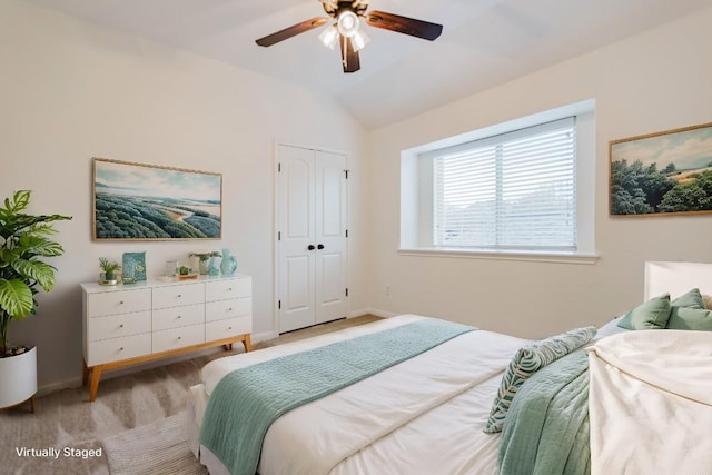 422 Village Commons Blvd, Georgetown, TX 78633 - bedroom featuring light colored carpet, lofted ceiling, baseboards, a ceiling fan, and a closet
