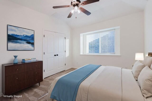 422 Village Commons Blvd, Georgetown, TX 78633 - carpeted bedroom with vaulted ceiling, a closet, ceiling fan, and baseboards