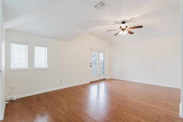 422 Village Commons Blvd, Georgetown, TX 78633 - spare room with a ceiling fan, wood finished floors, vaulted ceiling, and baseboards