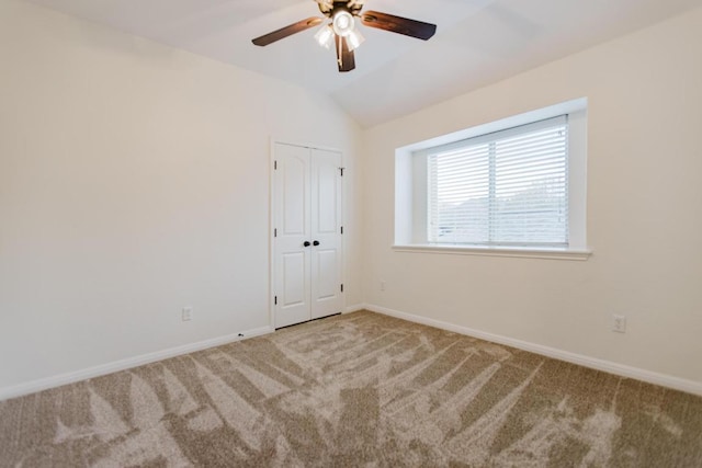 422 Village Commons Blvd, Georgetown, TX 78633 - unfurnished bedroom featuring carpet, baseboards, lofted ceiling, ceiling fan, and a closet