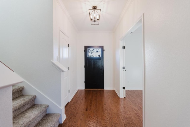 422 Village Commons Blvd, Georgetown, TX 78633 - entryway with wood finished floors, a chandelier, stairway, crown molding, and baseboards