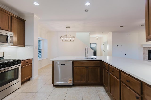 422 Village Commons Blvd, Georgetown, TX 78633 - kitchen featuring appliances with stainless steel finishes, a sink, light countertops, decorative backsplash, and recessed lighting