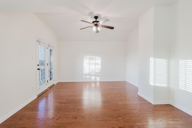 422 Village Commons Blvd, Georgetown, TX 78633 - empty room with vaulted ceiling, wood finished floors, a ceiling fan, and baseboards
