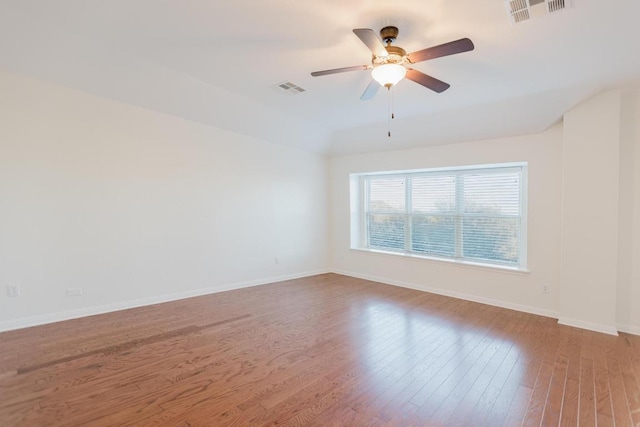 422 Village Commons Blvd, Georgetown, TX 78633 - empty room featuring wood finished floors, a ceiling fan, and baseboards