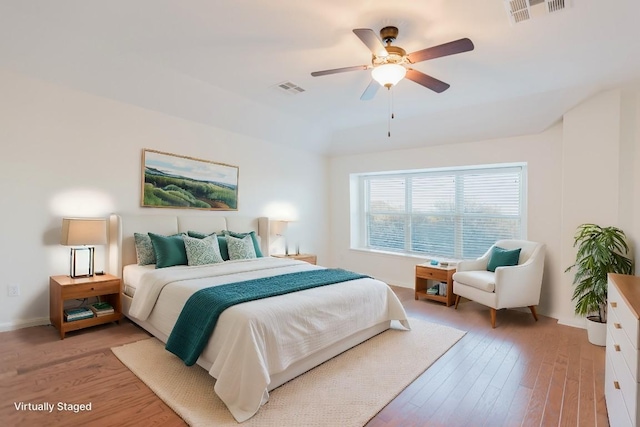 422 Village Commons Blvd, Georgetown, TX 78633 - bedroom with light wood-type flooring, a ceiling fan, and baseboards
