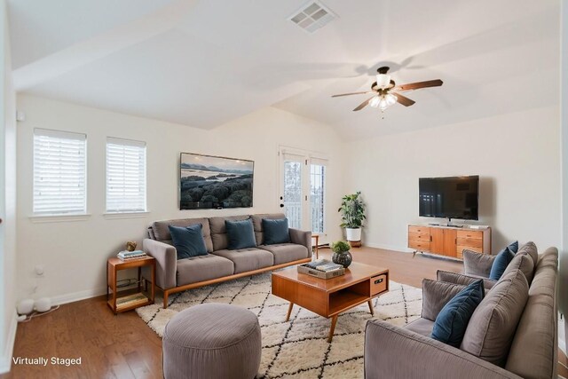 422 Village Commons Blvd, Georgetown, TX 78633 - living area with ceiling fan, vaulted ceiling, baseboards, and wood finished floors