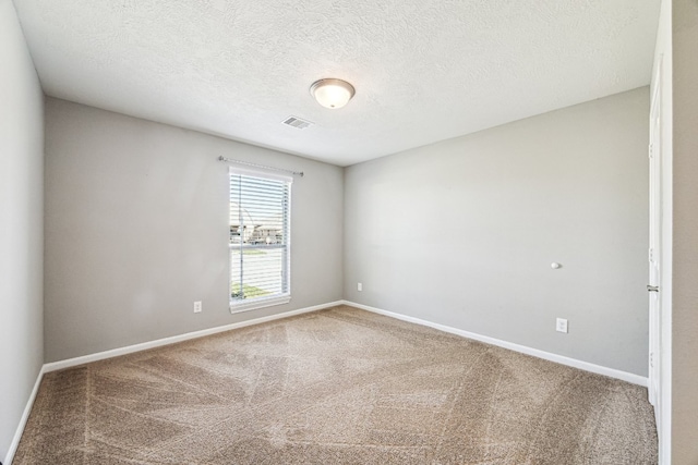 2502 Grey Kirby Dr, League City, TX 77573 - carpeted empty room featuring baseboards and a textured ceiling
