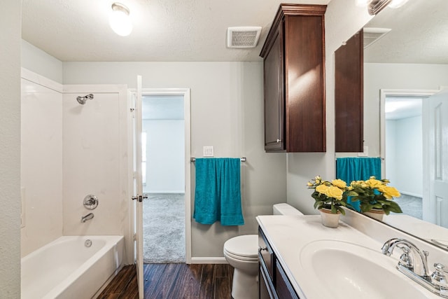 2502 Grey Kirby Dr, League City, TX 77573 - full bath with wood finished floors, toilet, vanity, bathing tub / shower combination, and a textured ceiling