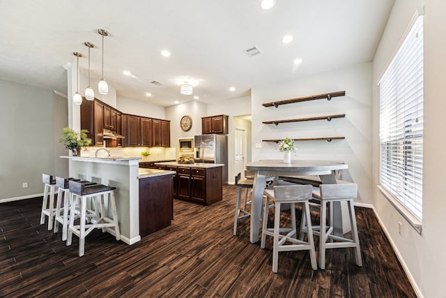 2502 Grey Kirby Dr, League City, TX 77573 - kitchen featuring dark wood-style flooring, baseboards, a peninsula, recessed lighting, and healthy amount of natural light