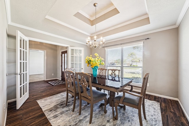 2502 Grey Kirby Dr, League City, TX 77573 - dining room with a tray ceiling, french doors, a chandelier, baseboards, and crown molding