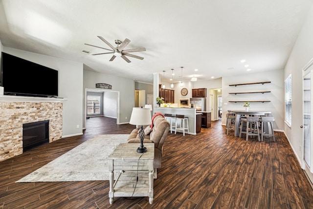 2502 Grey Kirby Dr, League City, TX 77573 - living room featuring dark wood-type flooring, ceiling fan, a fireplace, baseboards, and recessed lighting