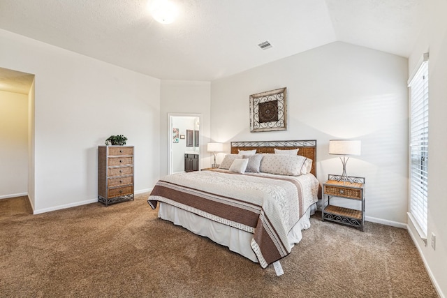 2502 Grey Kirby Dr, League City, TX 77573 - bedroom with carpet, baseboards, vaulted ceiling, and connected bathroom
