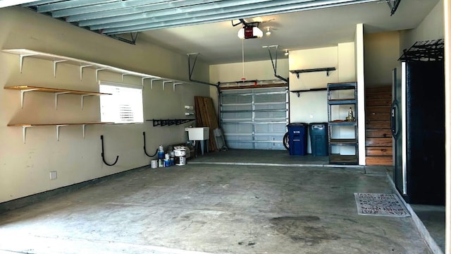2502 Grey Kirby Dr, League City, TX 77573 - garage featuring a garage door opener and freestanding refrigerator