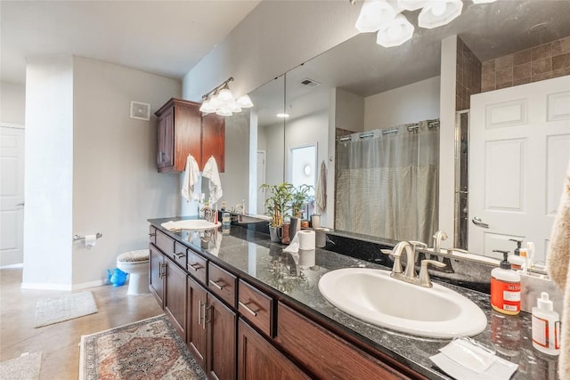 bathroom with a sink, visible vents, double vanity, and a shower with shower curtain