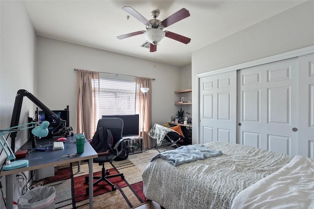 bedroom with visible vents, a closet, and ceiling fan