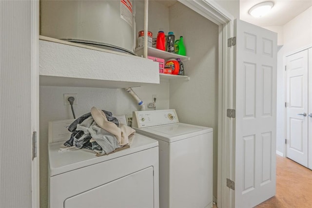 washroom featuring independent washer and dryer and laundry area