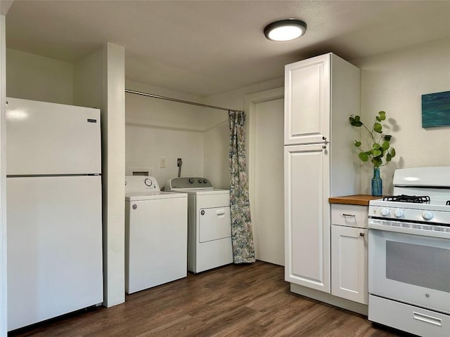 interior space with washer and clothes dryer, white cabinets, dark wood-style flooring, and white appliances