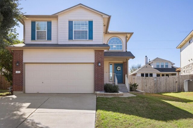 1631 Plume Grass Pl, Round Rock, TX 78665 - traditional home featuring brick siding, an attached garage, cooling unit, and driveway