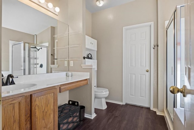 1631 Plume Grass Pl, Round Rock, TX 78665 - full bath with a stall shower, wood finished floors, toilet, vanity, and baseboards