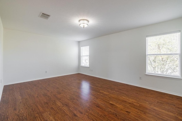 101 Verde Ranch Loop, Leander, TX 78641 - empty room with dark wood-style flooring and baseboards