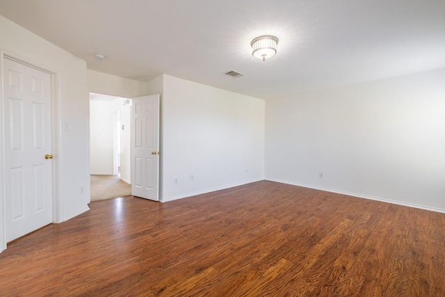 101 Verde Ranch Loop, Leander, TX 78641 - empty room with wood finished floors, baseboards, and a smoke detector