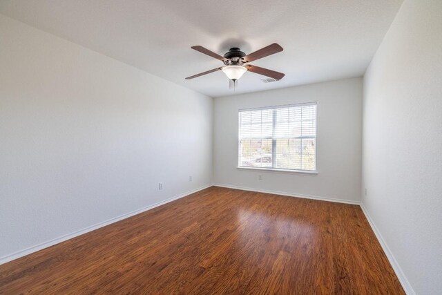 101 Verde Ranch Loop, Leander, TX 78641 - unfurnished room featuring ceiling fan, dark wood-style flooring, and baseboards