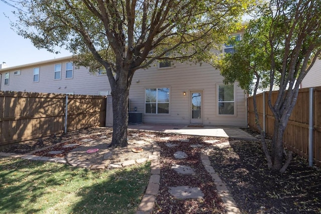 101 Verde Ranch Loop, Leander, TX 78641 - rear view of house with a fenced backyard, a patio, and central AC unit