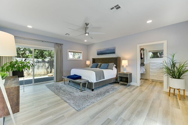 8702 Silverhill Ln, Austin, TX 78759 - bedroom with light wood-style floors, baseboards, access to exterior, recessed lighting, and ceiling fan