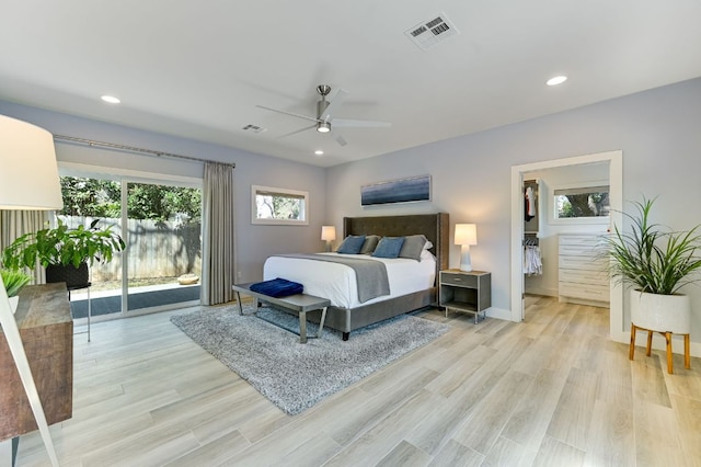 8702 Silverhill Ln, Austin, TX 78759 - bedroom featuring light wood finished floors, access to exterior, recessed lighting, and ceiling fan