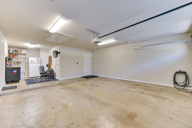 8702 Silverhill Ln, Austin, TX 78759 - garage with freestanding refrigerator and a garage door opener