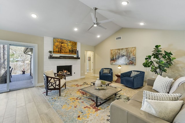 8702 Silverhill Ln, Austin, TX 78759 - living room with a ceiling fan, lofted ceiling, a fireplace, recessed lighting, and baseboards