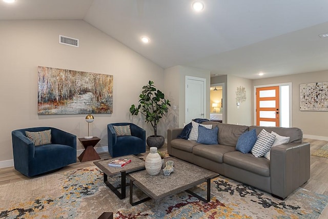 8702 Silverhill Ln, Austin, TX 78759 - living area with wood finished floors, baseboards, lofted ceiling, and recessed lighting