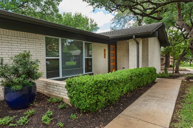 8702 Silverhill Ln, Austin, TX 78759 - view of exterior entry featuring brick siding