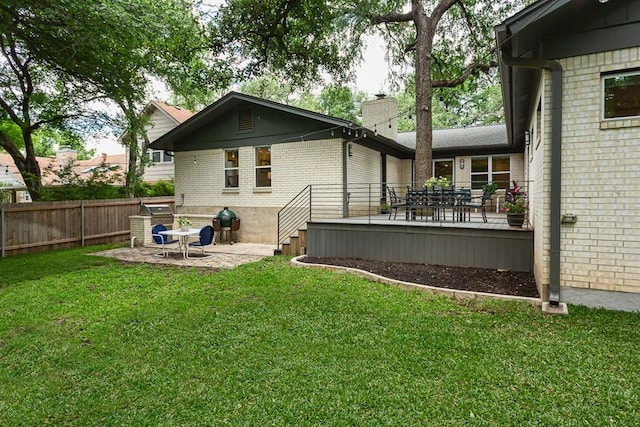 8702 Silverhill Ln, Austin, TX 78759 - back of house featuring brick siding, a chimney, a patio area, and a deck