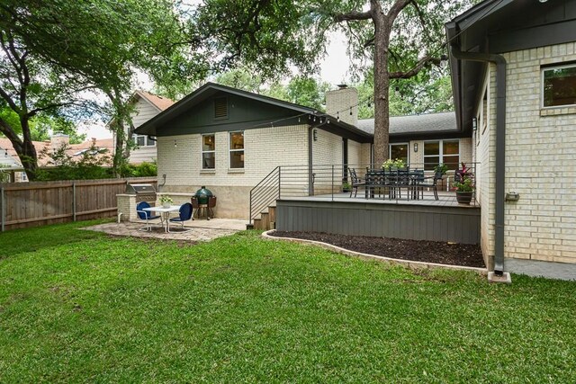 8702 Silverhill Ln, Austin, TX 78759 - back of property featuring brick siding, a chimney, a patio, and a deck