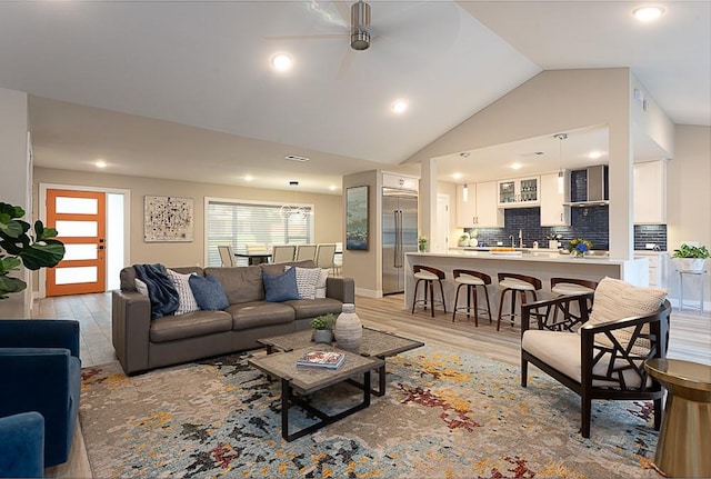 8702 Silverhill Ln, Austin, TX 78759 - living room with ceiling fan, light wood-style flooring, lofted ceiling, and recessed lighting