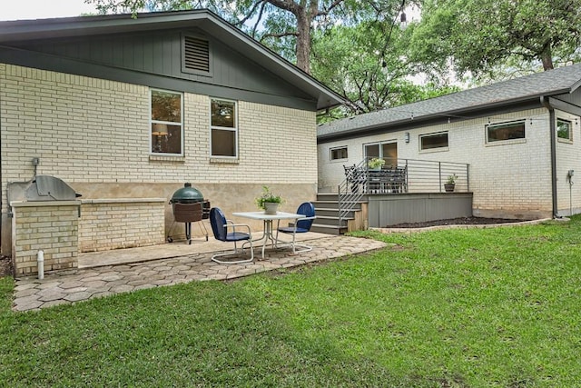 8702 Silverhill Ln, Austin, TX 78759 - rear view of house featuring brick siding, a patio area, a lawn, and an outdoor kitchen