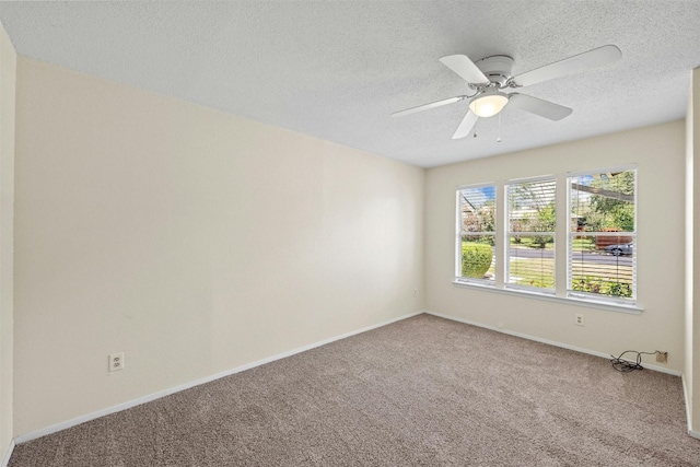11921 Tanglebriar Trl, Austin, TX 78750 - empty room with carpet floors, a textured ceiling, baseboards, and ceiling fan