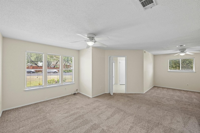 11921 Tanglebriar Trl, Austin, TX 78750 - carpeted spare room featuring ceiling fan, a textured ceiling, and baseboards