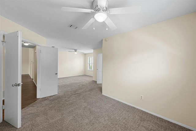 11921 Tanglebriar Trl, Austin, TX 78750 - carpeted empty room with ceiling fan and baseboards